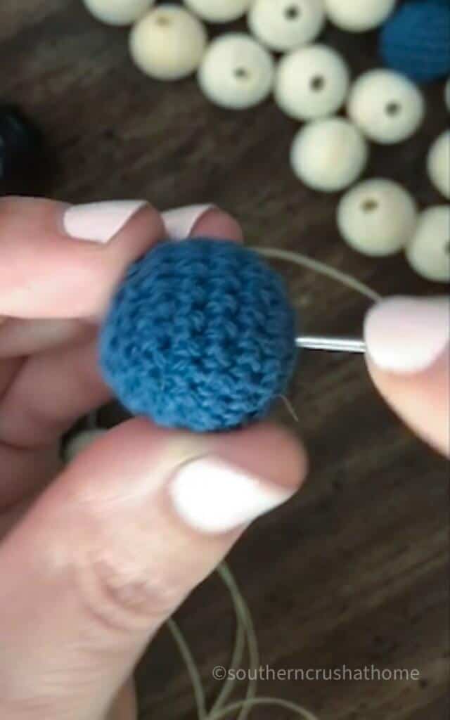 threading crocheted wood bead