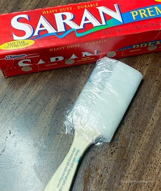 Saran wrap used to keep paint on paintbrush fresh