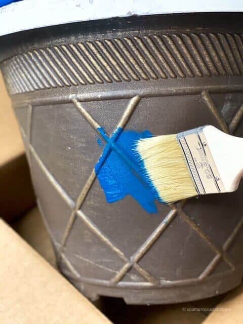 Painting planters with bright blue DIY chalk paint