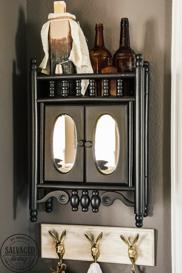 black painted medicine cabinet on wall