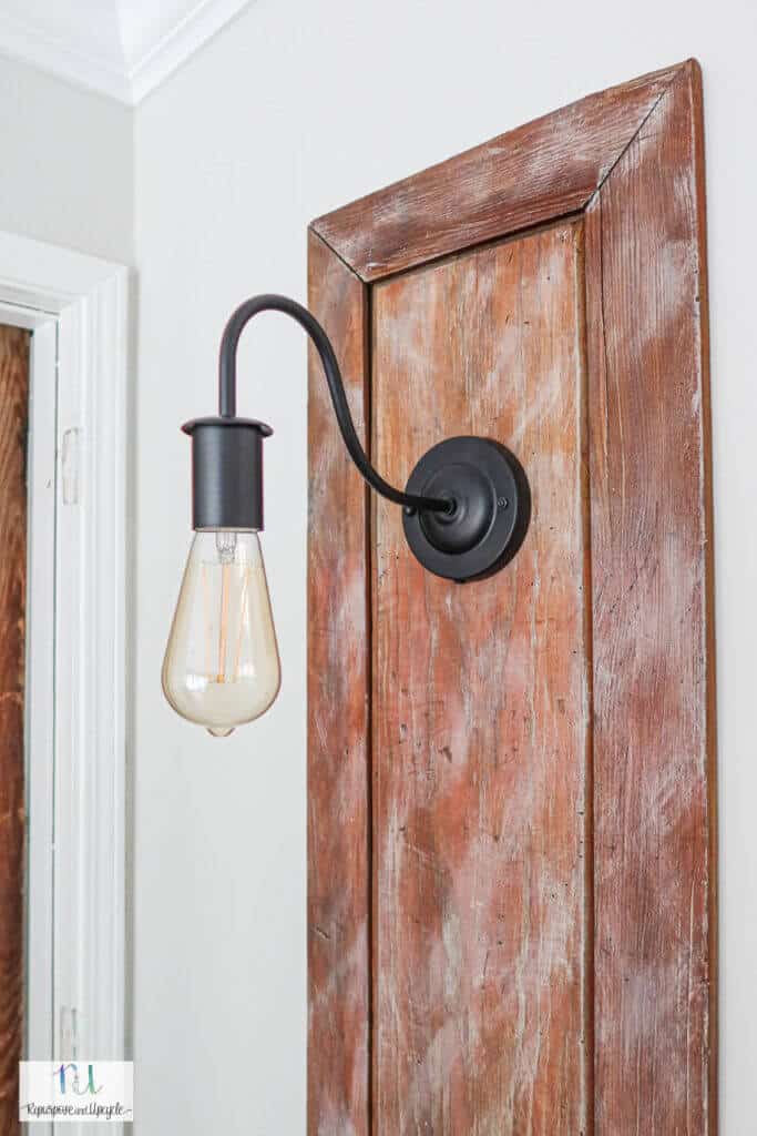 vintage door with wall sconce