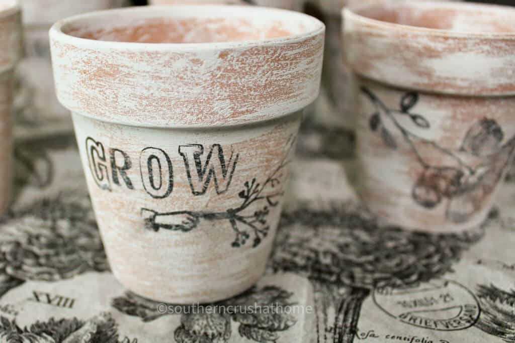 Grow stamped on dollar tree terra cotta pots