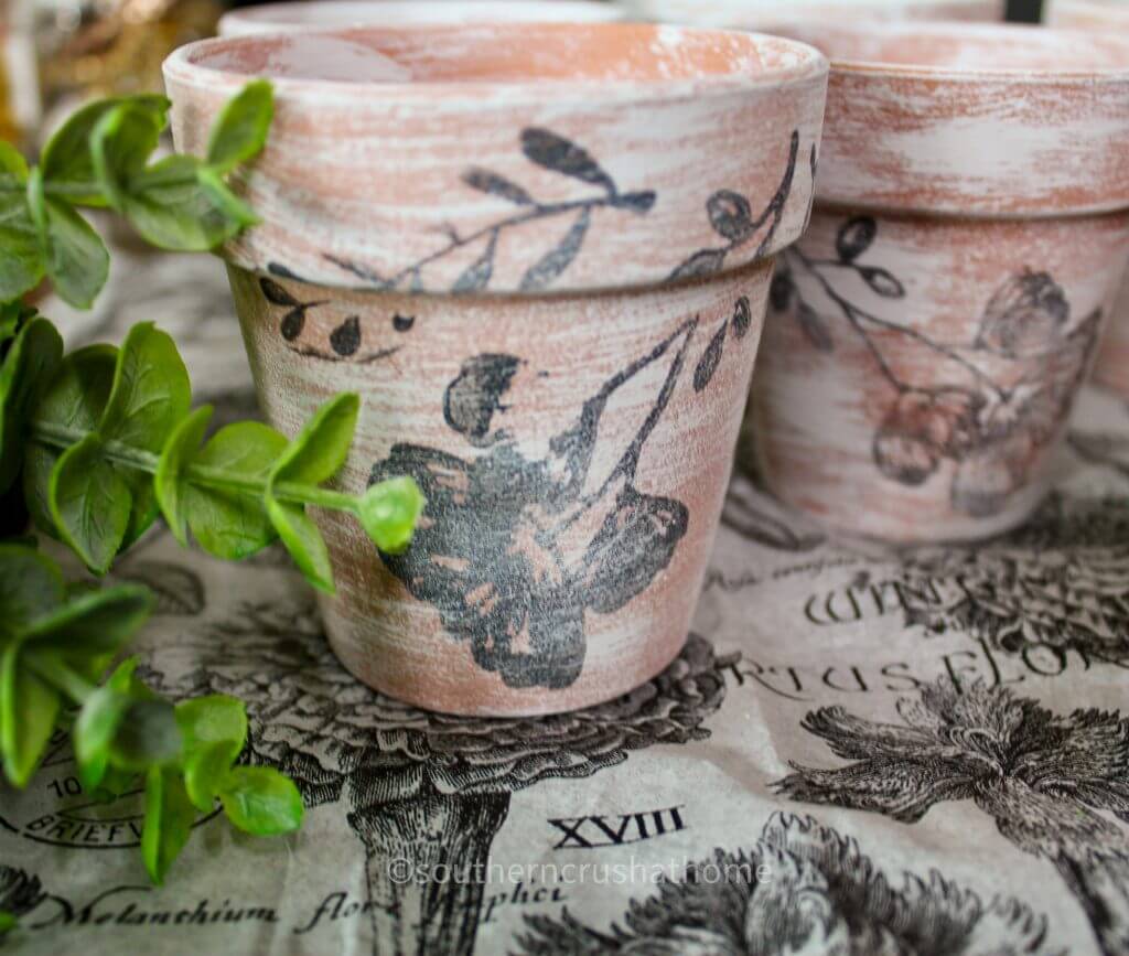 close up of stamped flower on dollar tree terra cotta pots