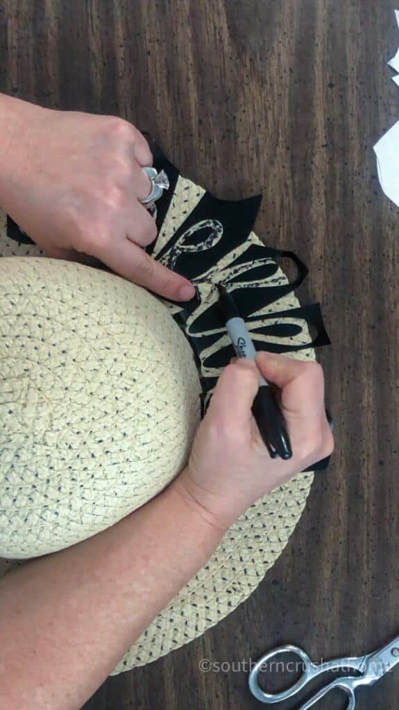 decorating sun hat with sharpie marker