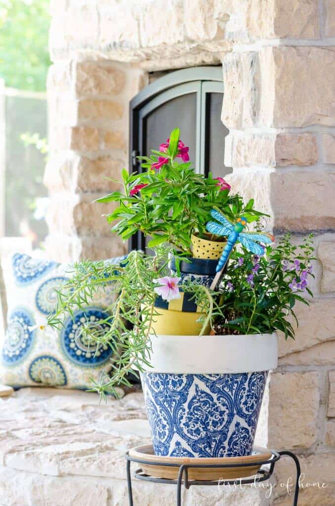 decoupaged clay pot on porch