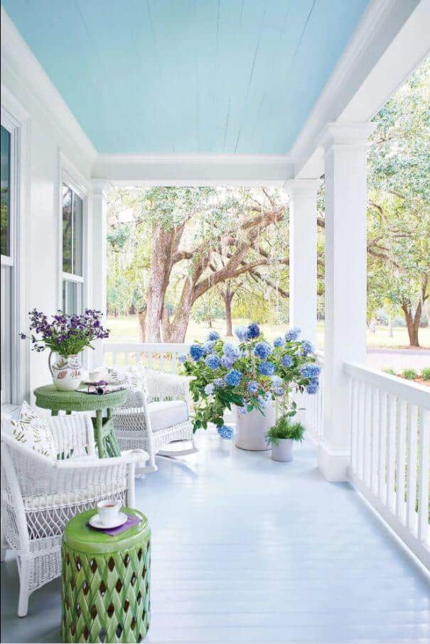 blue and white summer front porch with hydrangeas