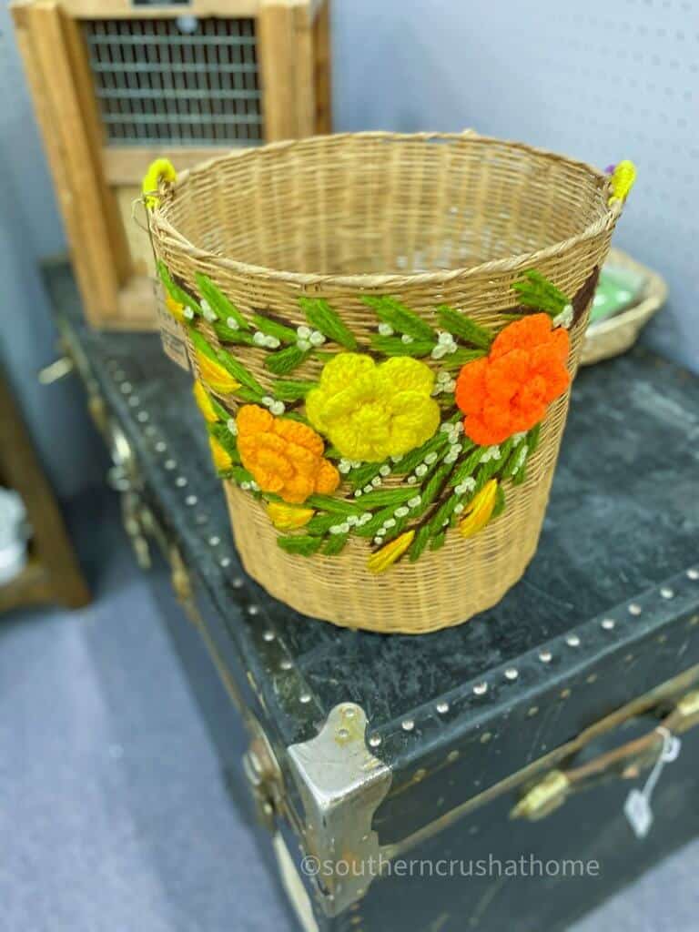 vintage waste basket with yarn flowers