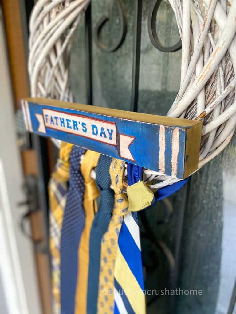 side view of necktie wreath on door