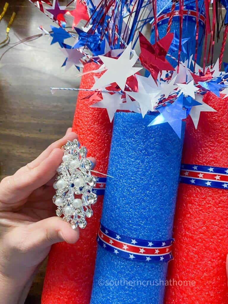 securing embellishment to firecracker pool noodle