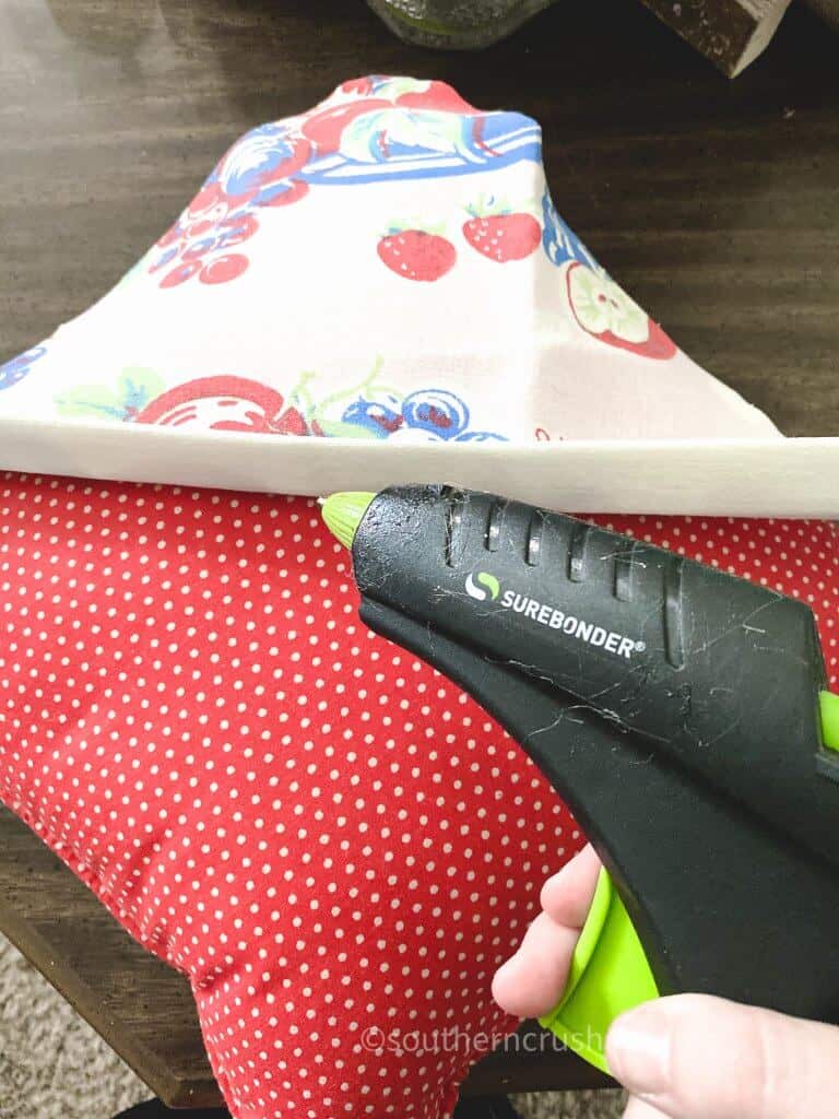 using hot glue gun on fabric pillow