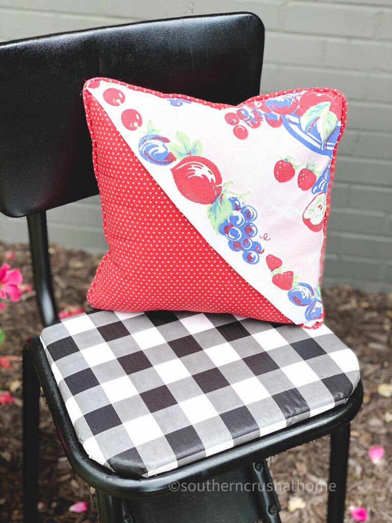 finished thrift store pillow makeover on chair