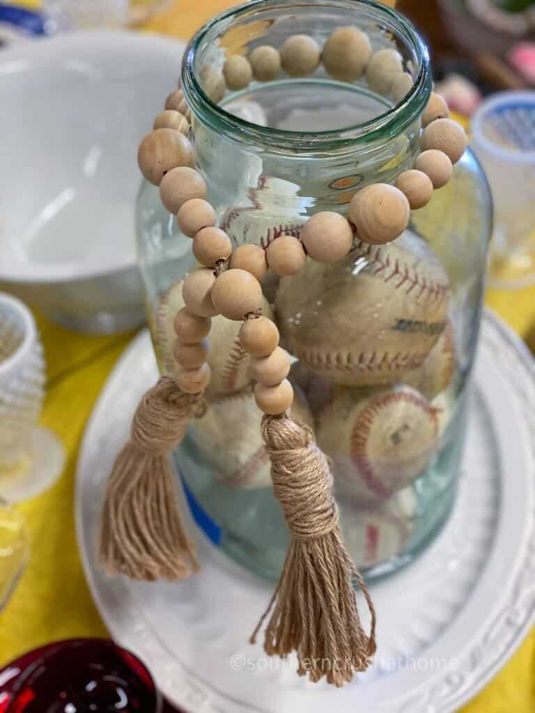 baseball collection in a jar with wooden beaded tassel