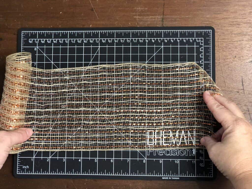 measuring out 12 inches of mesh