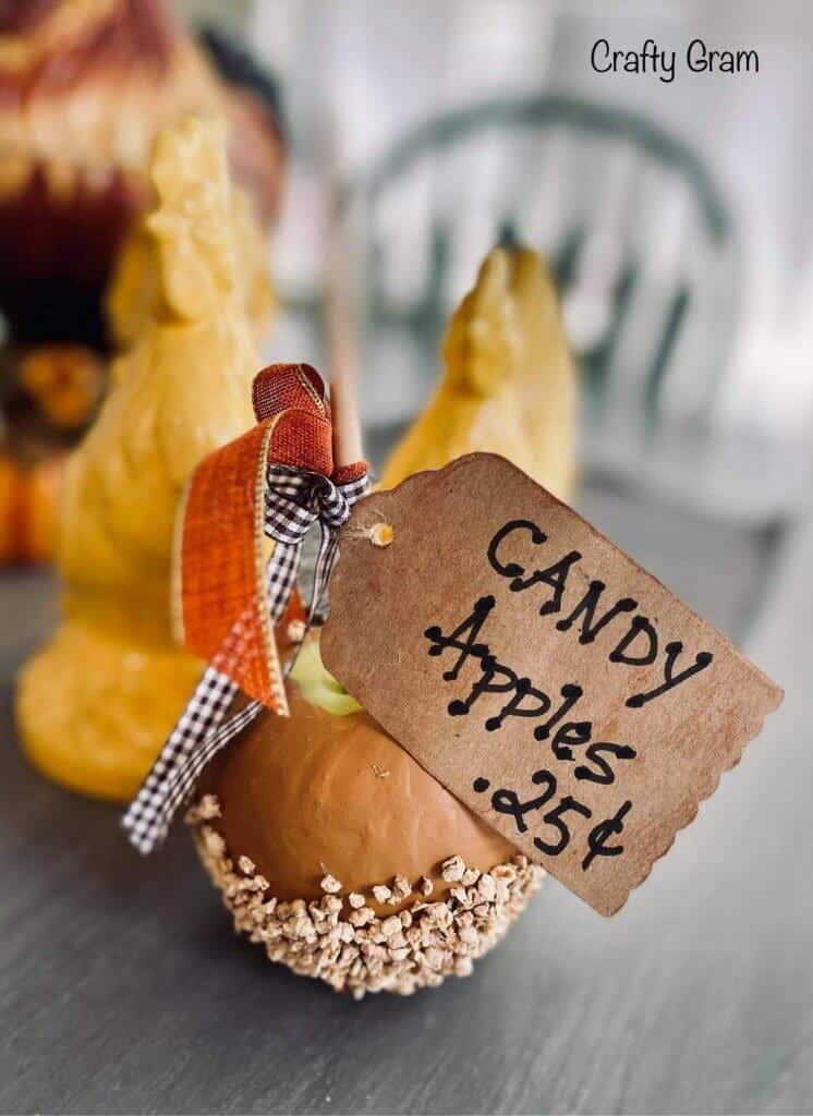 single faux candy apple with tag