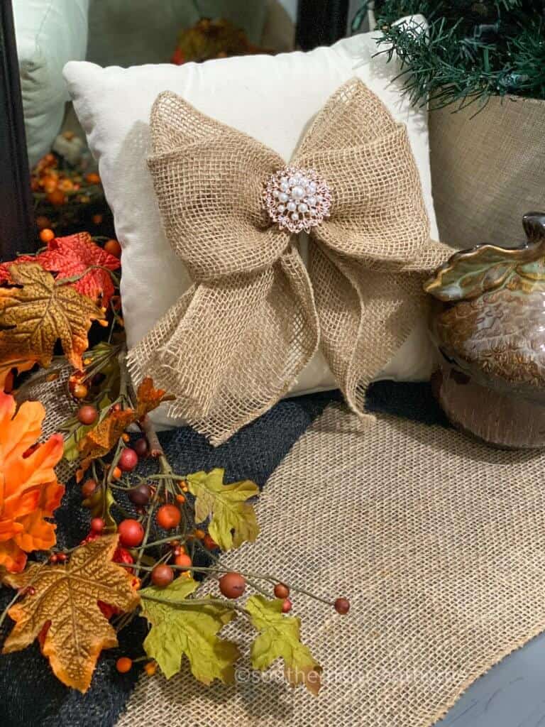 easy burlap bow shown on pillow