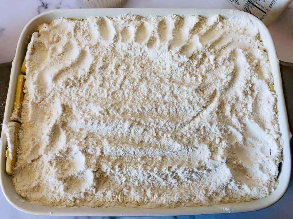 adding flour to top of cake