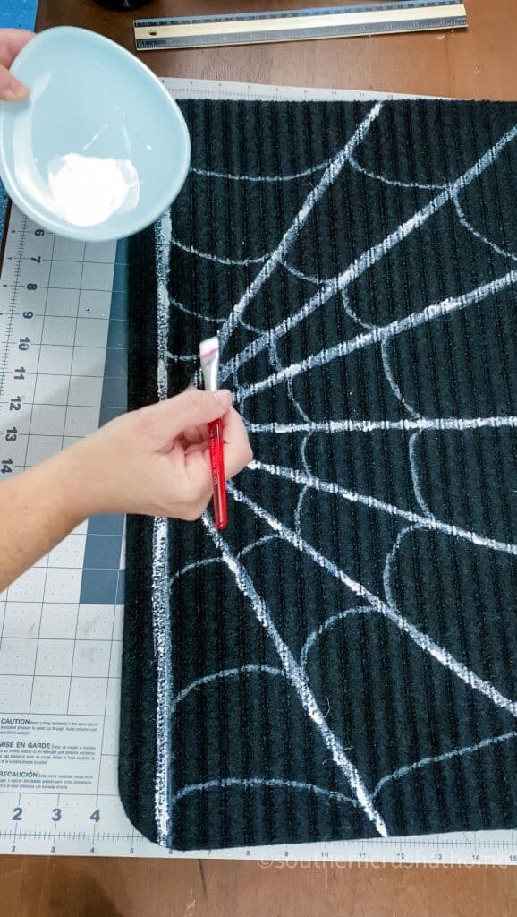 using white paint on spiderweb doormat