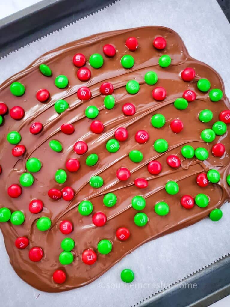 finished m&m's holiday chocolate bark on baking sheet