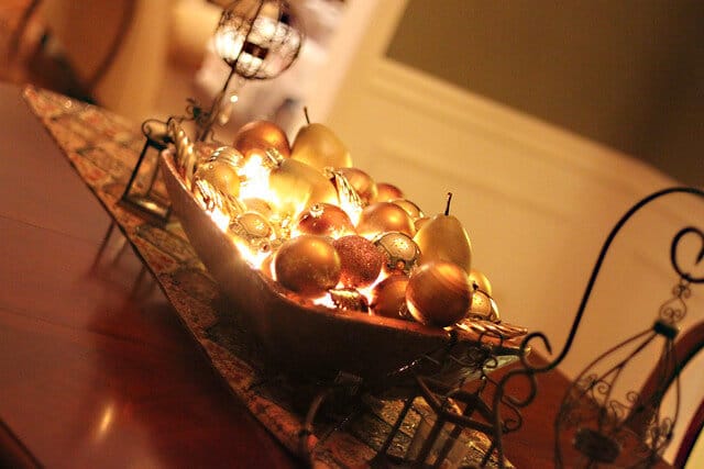 ornaments in a bowl with lights