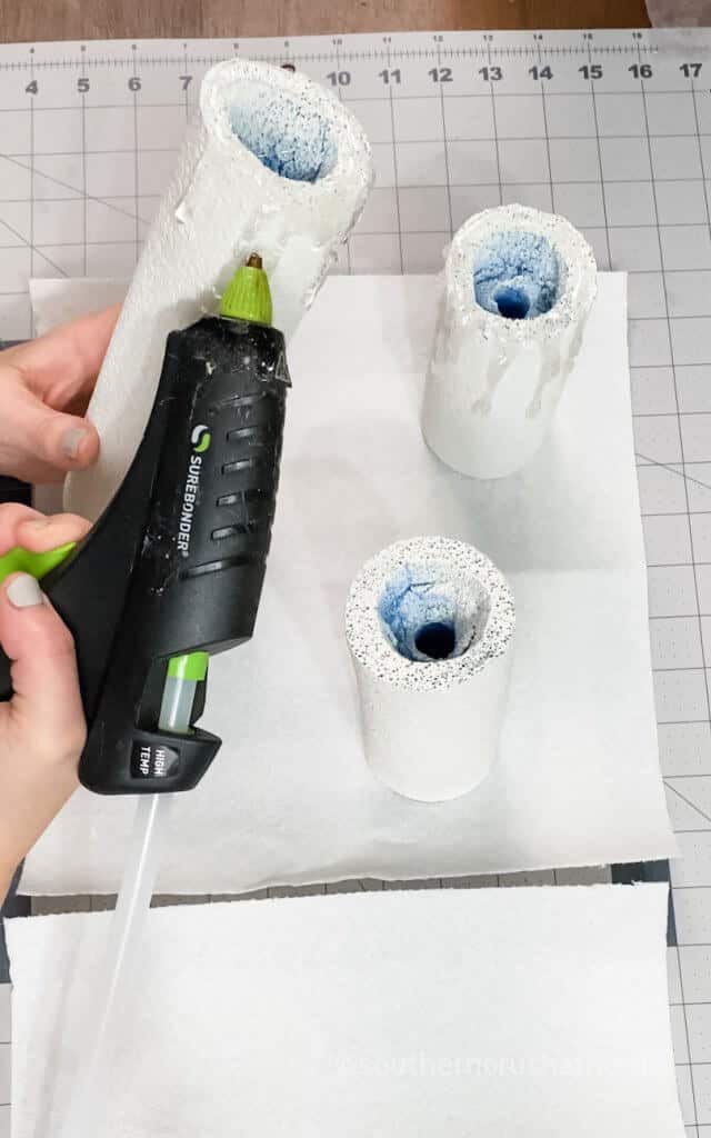 using hot glue gun to add candle wax