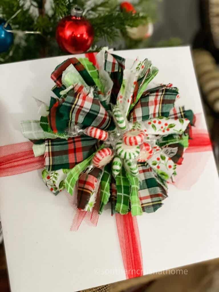 messy bow with peppermint candies in the center