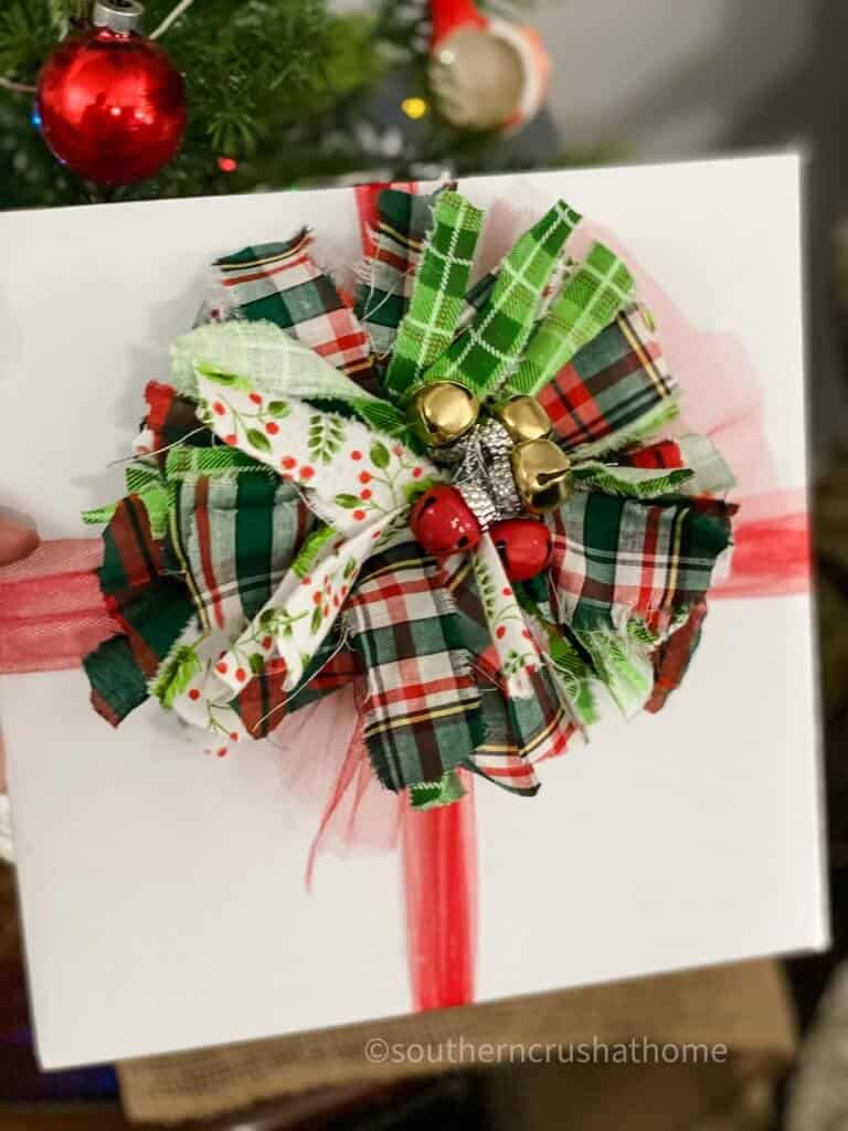 christmas bow with painted jingle bells in the center