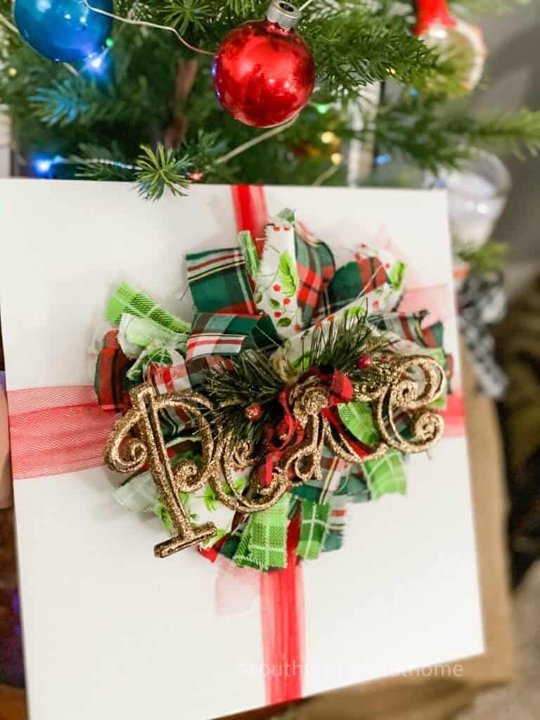 christmas messy bow with peace ornament center