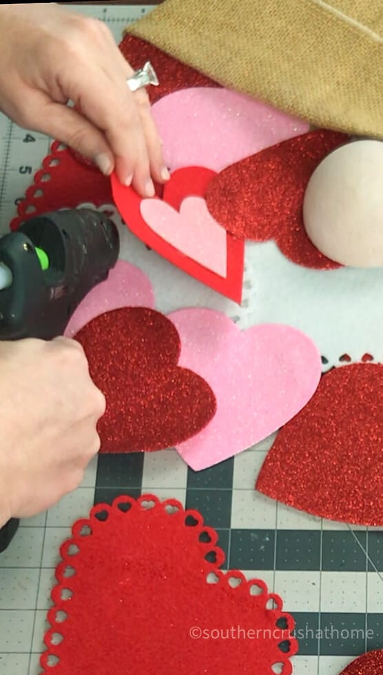 gluing paper hearts for gnome