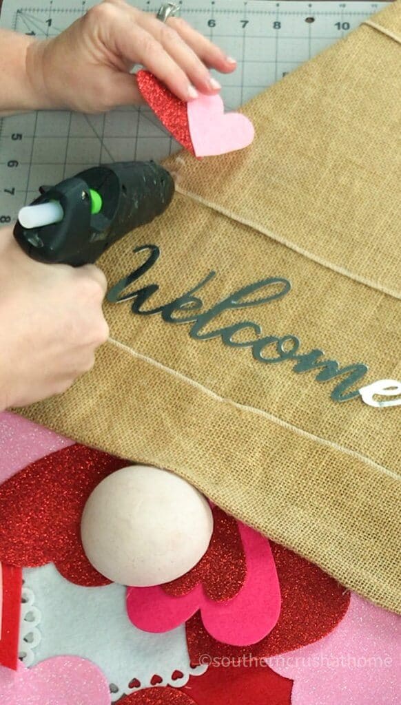 gluing welcome sign to gnome