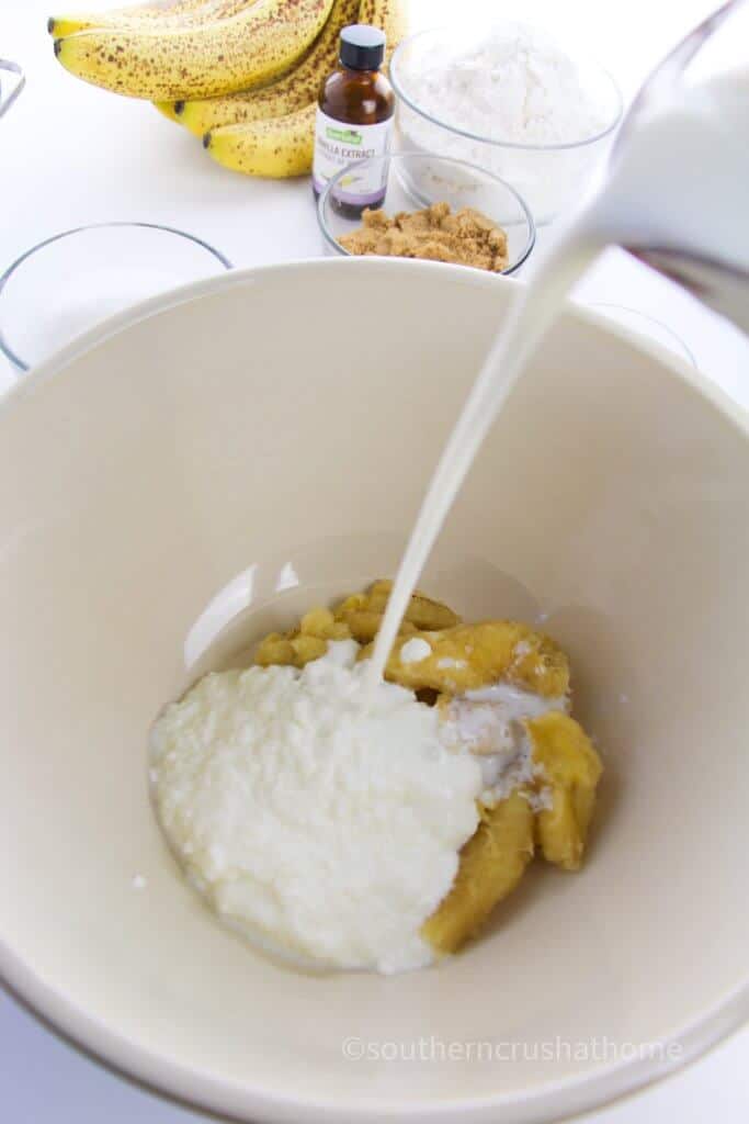 mixing bananas with dry ingredients