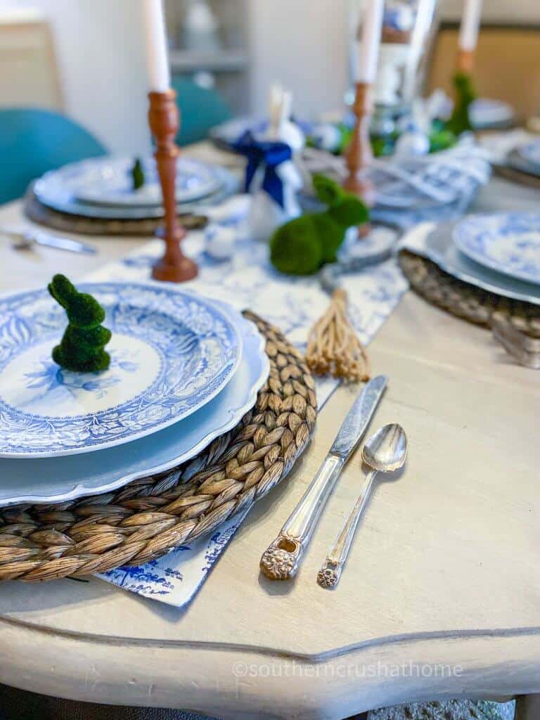 close up of blue and white Easter table setting with candles