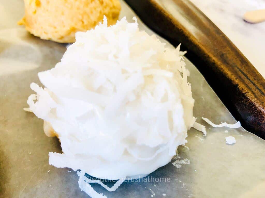 adding white chocolate and coconut to truffles
