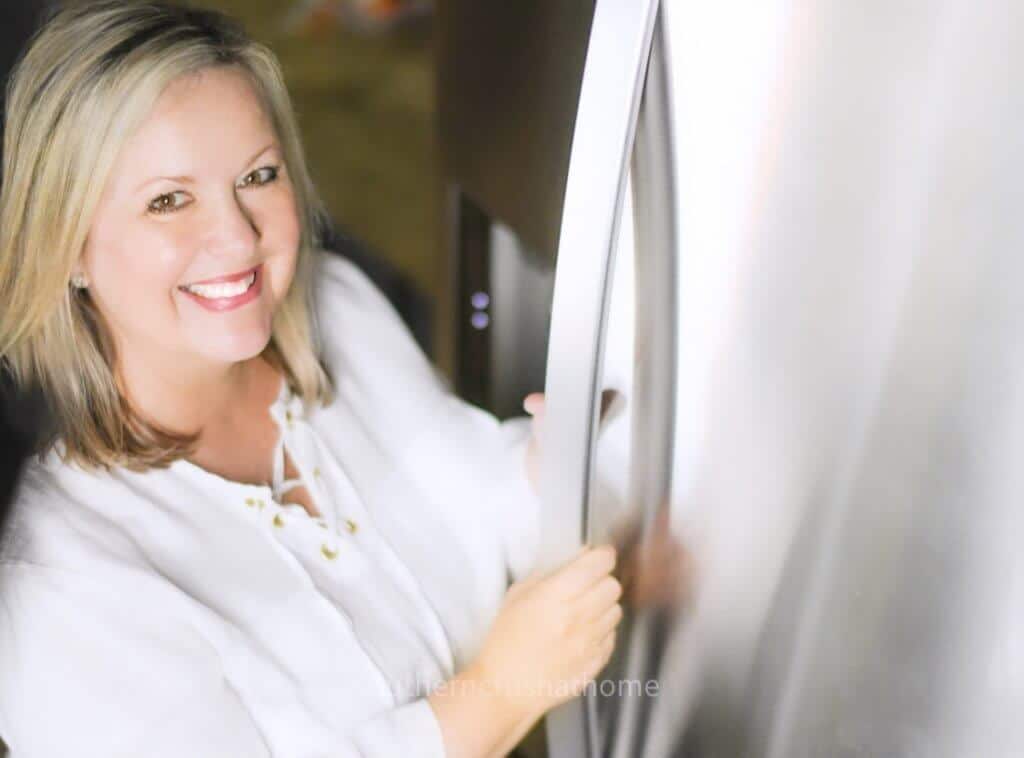 Melanie Ferguson opening refrigerator door