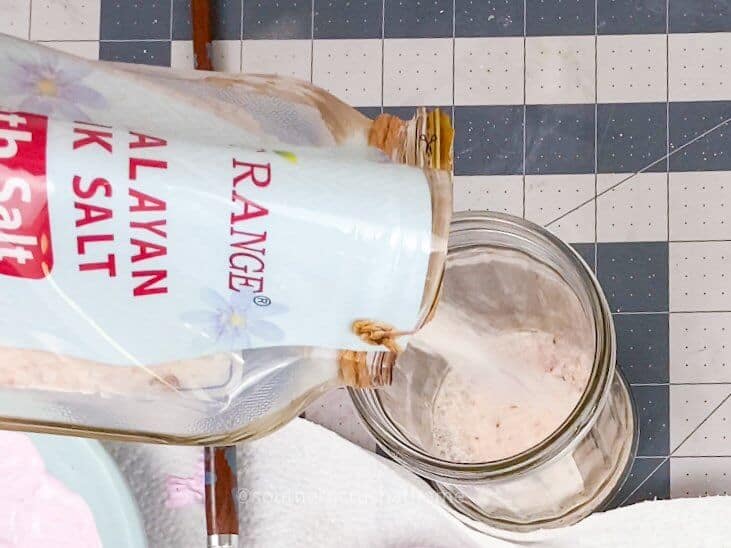 pouring bath salt in jar for mother's day gift idea