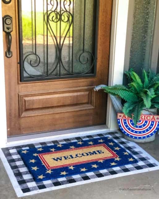 painted doormat with patriotic doormat layered on top