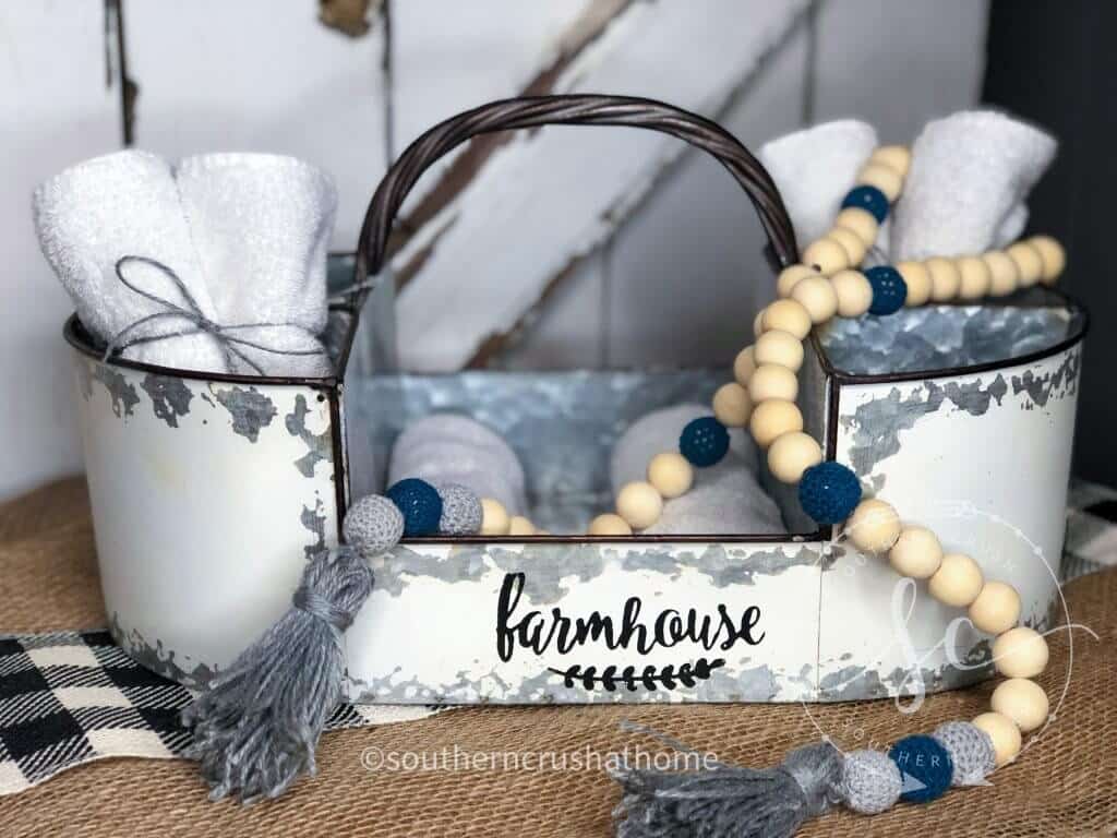 wood bead garland draped over a farmhouse tray