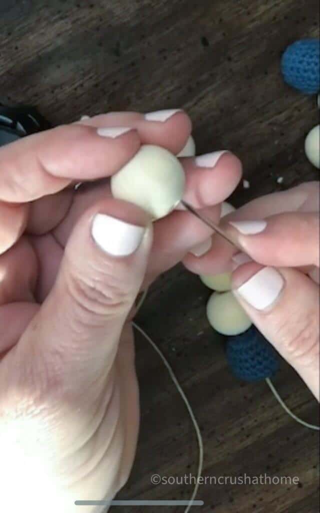 threading a wooden bead