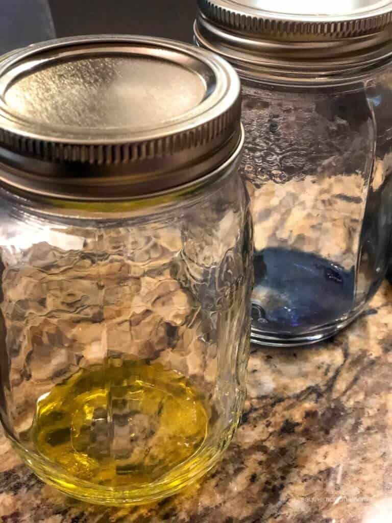 Yellow and blue glass stain inside glass mason jars