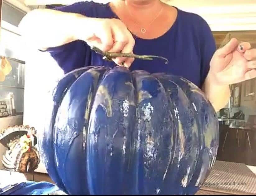 A painted navy blue pumpkin