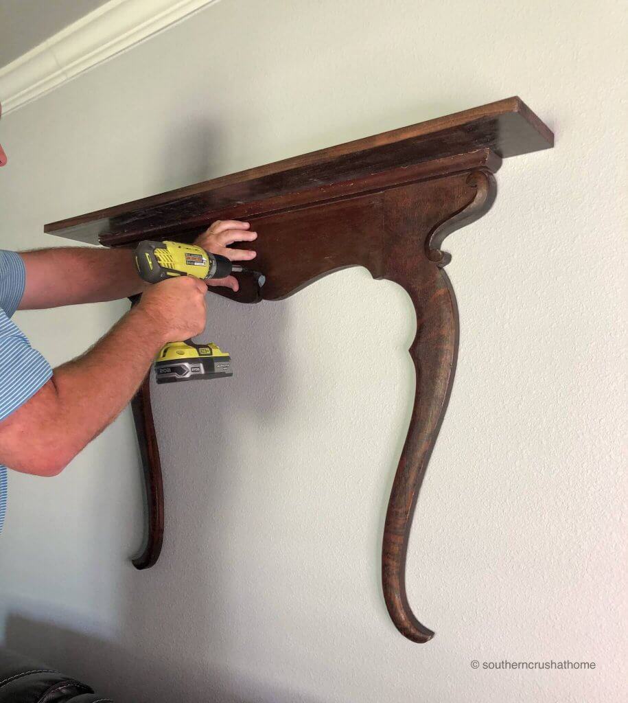 Attaching the shelf to the wall