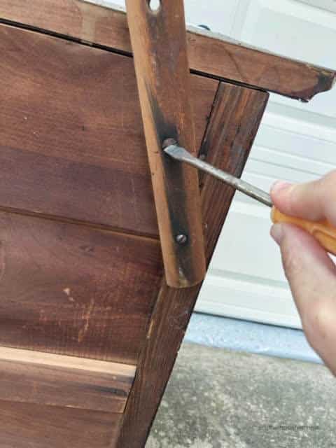 Taking the mirror off of the dresser