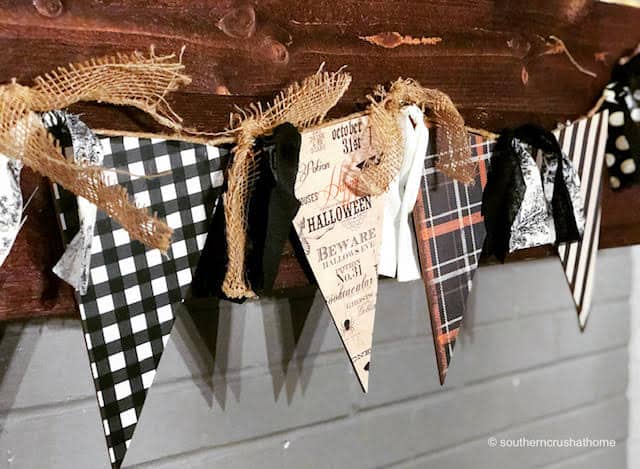 DIY Halloween banner hanging on the mantel 