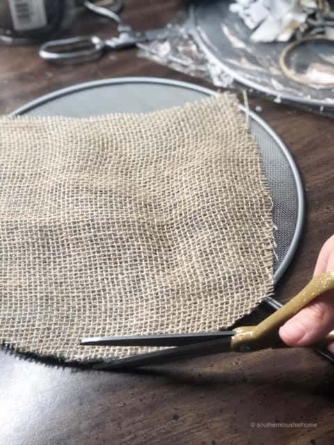 Trimming burlap around the splatter screen