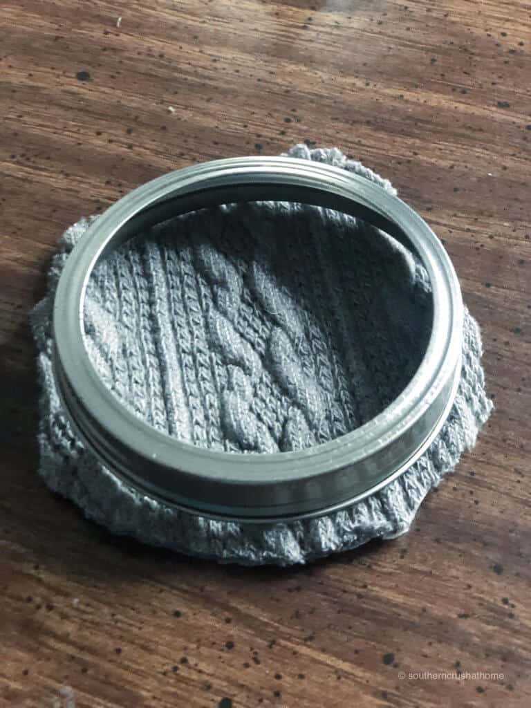 Placing mason jar lid together