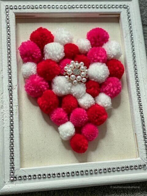 reverse canvas pom pom heart diy