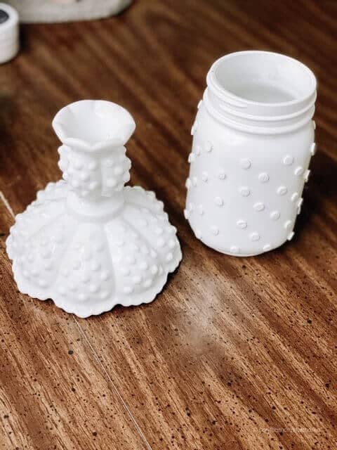 An original Hobnail milk glass vase next to a DIY version