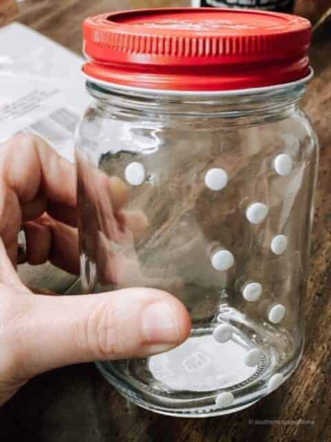 Adding pop-dot adhesives to a glass jar 