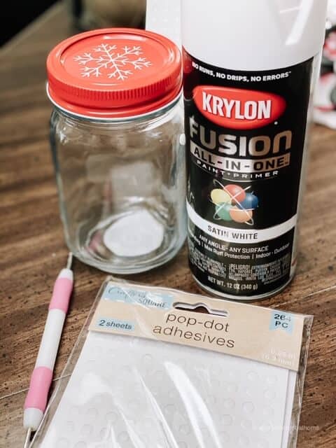 Supplies for a DIY hobnail milk glass - a jar, pop-dot adhesives, and Krylon primer