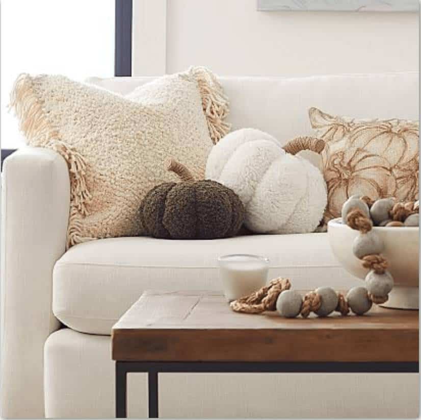 Cozy pumpkin pillow decor on sofa