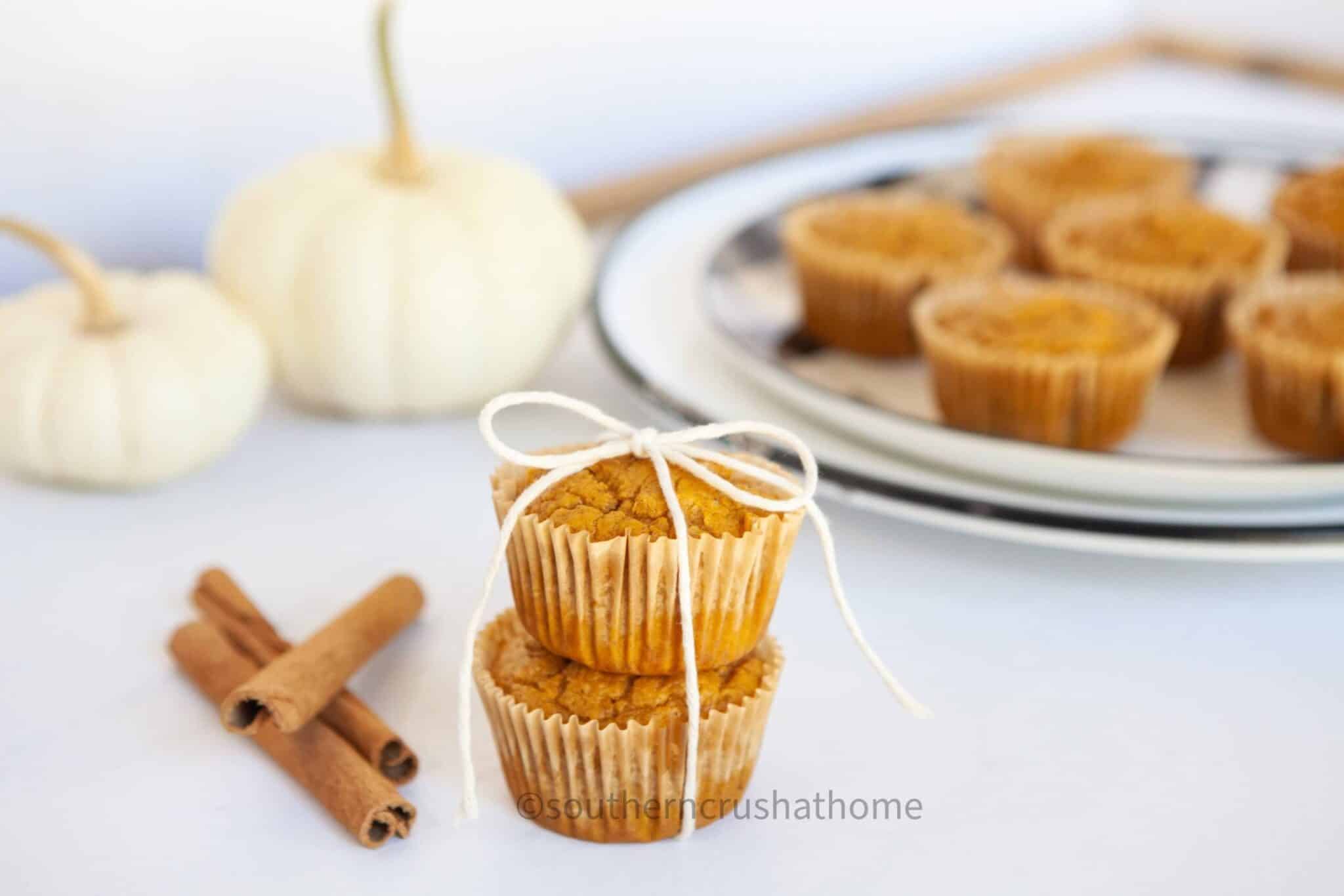 3 ingredient pumpkin muffins stacked with twine